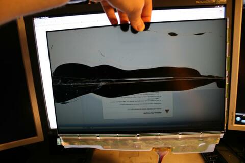 Bit-tech forums user Smilodon cutting an LCD screen